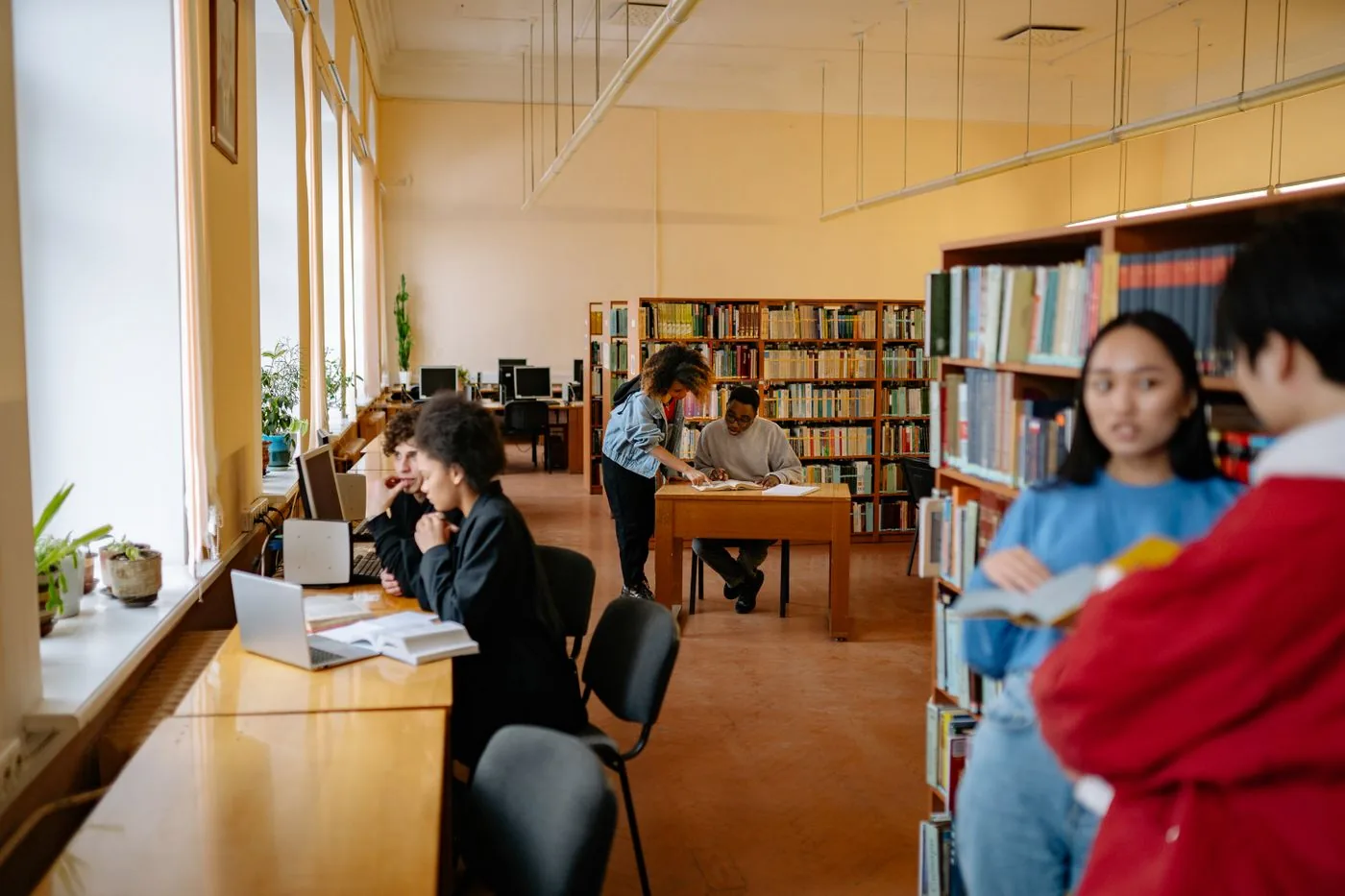 Students studying and collaborating in a library